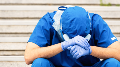 Thumbnail overworked male doctor