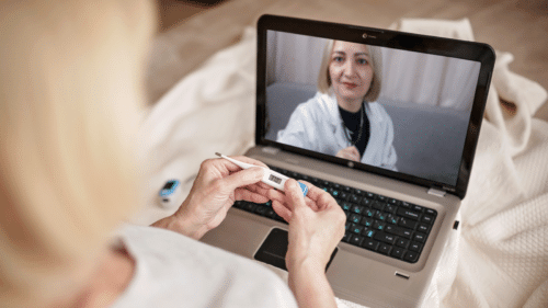 Woman having a telehealth appointment with her doctor from home